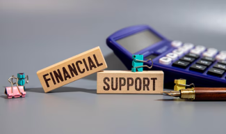 Wooden blocks that say "Financial support" on them
