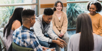 a group of students sitting in a circles