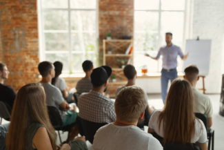 a group of people sitting in a class